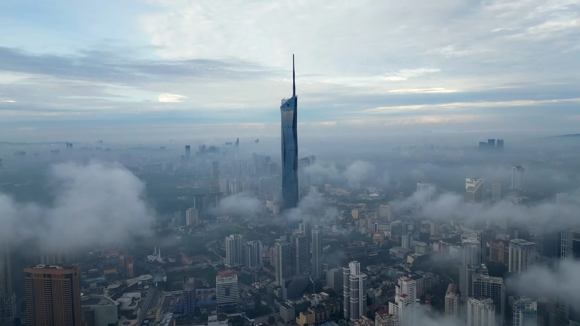Kuala Lumpur skyline above the clouds
