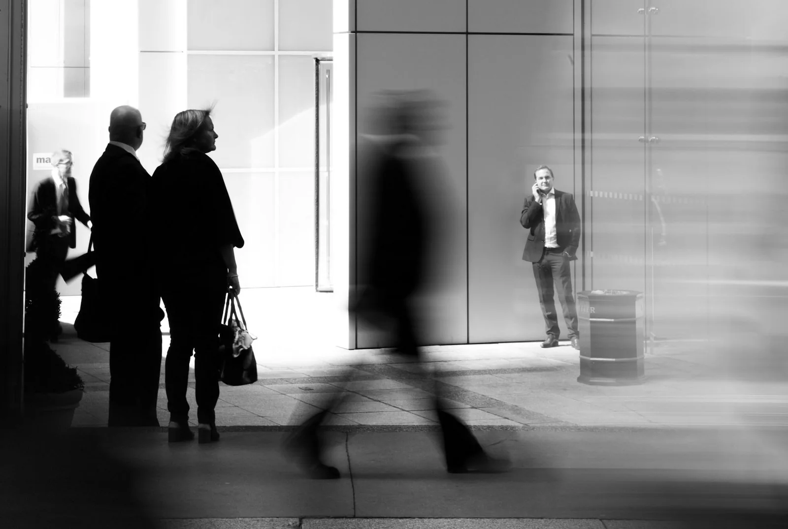 People walking through a bright concourse