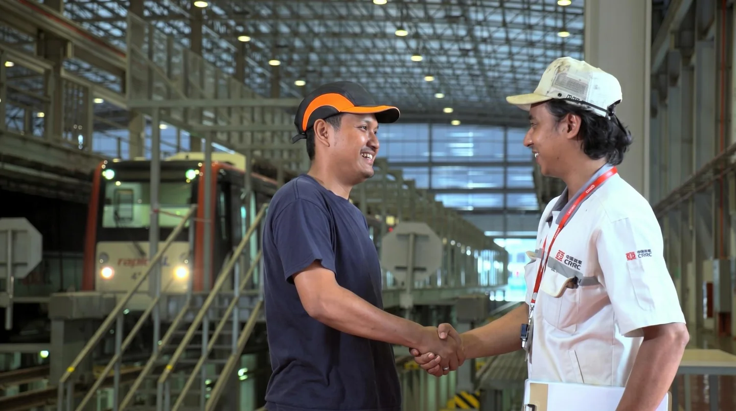 CRRC Malaysia technicians collaborating on the depot floor